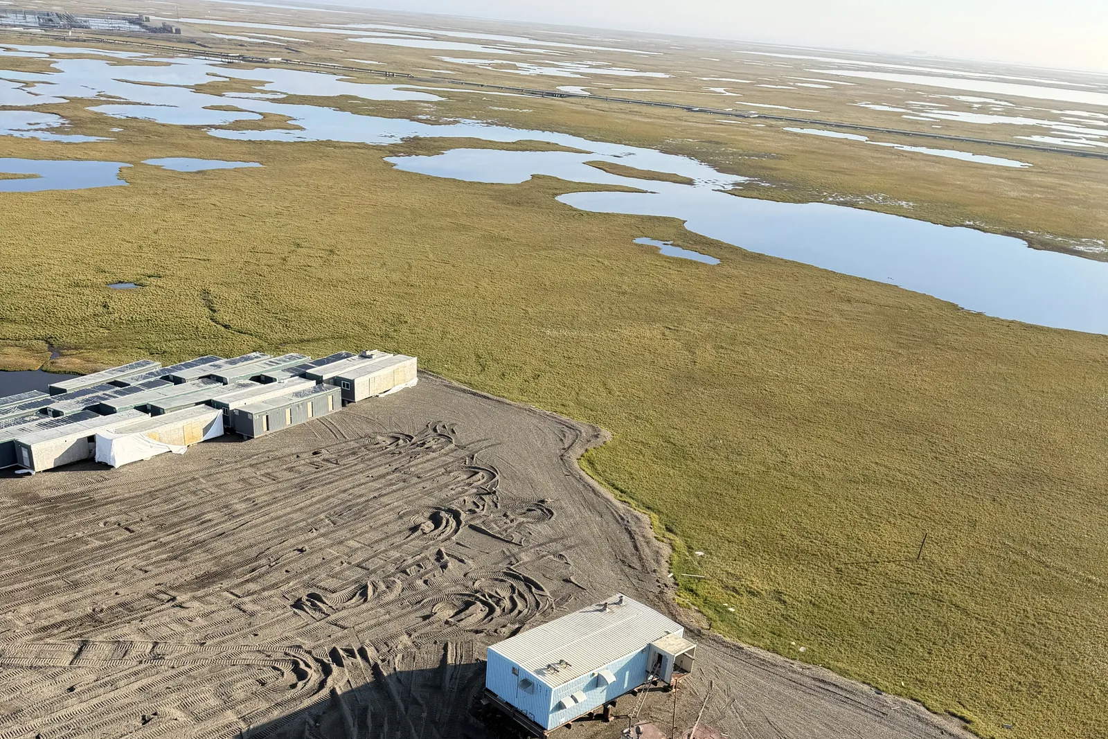 Aerial view of Frontier Pad on the North Slope tundra with lakes to the horizon