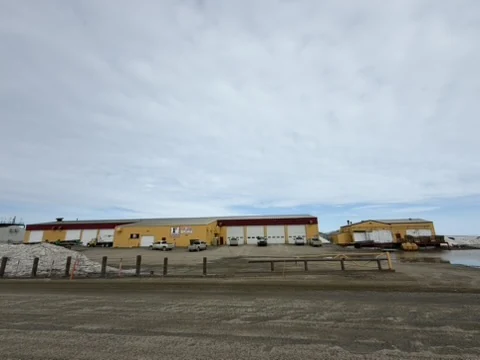 The full Frontier shop complex across the gravel pad