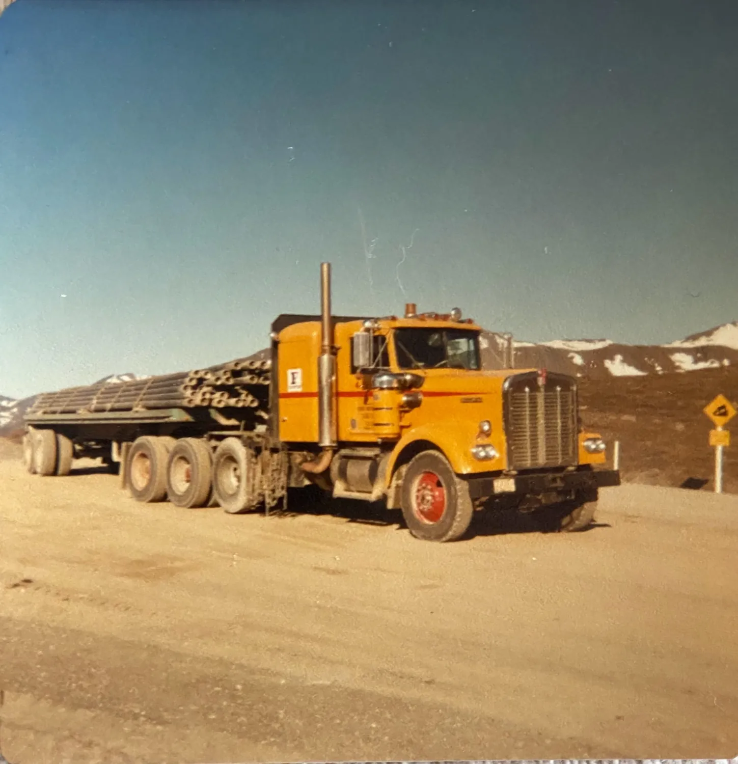 Frontier Kenworth hauling pipe up the North Slope haul road in the 1970s