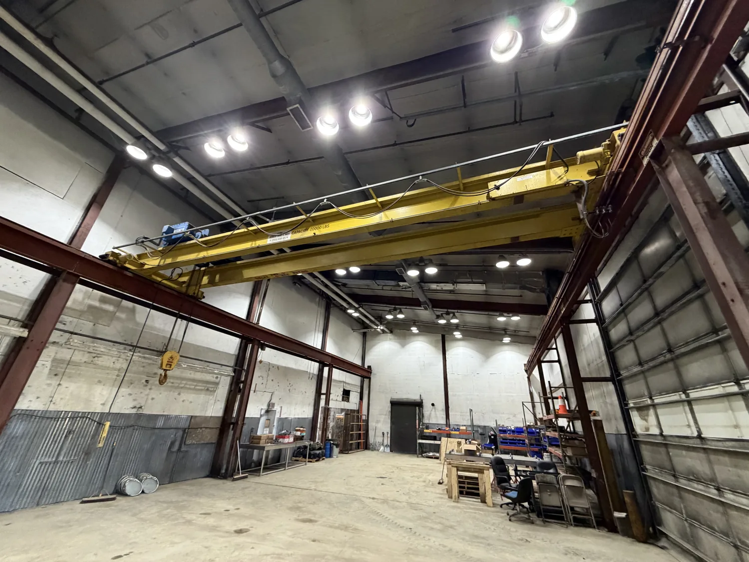 Inside a Frontier shop bay with a yellow overhead bridge crane