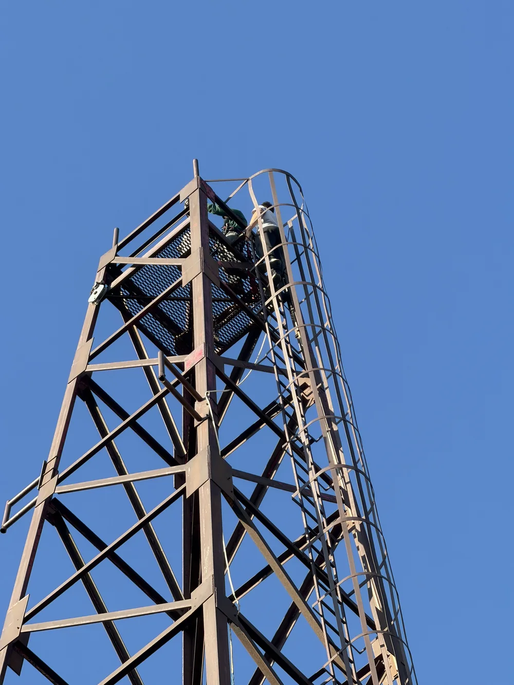 The standing steel tower at Frontier against a blue sky